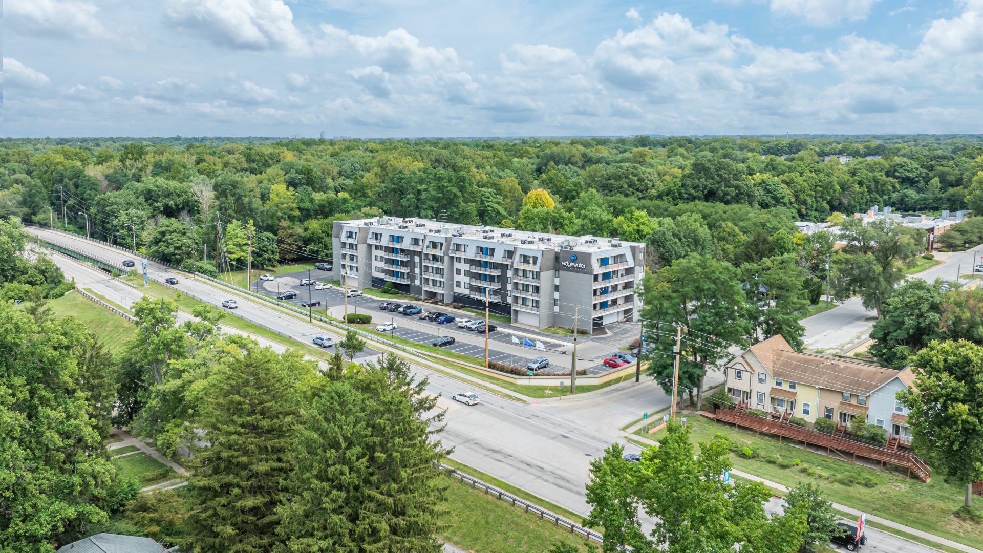a large white bus driving down a street